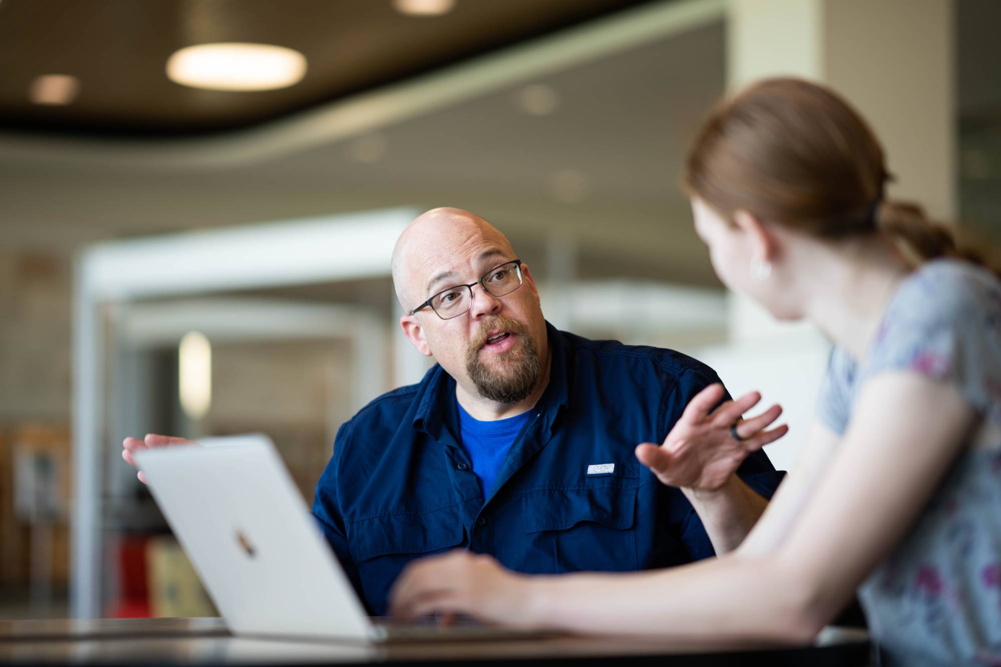 faculty speaking to a student